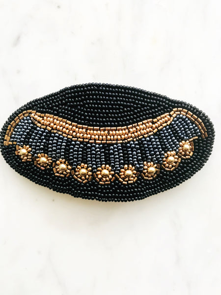 Add some vintage charm to your hair with this hand-crafted seed bead barrette. Made in France, it's a unique and stylish accessory that will elevate any hairstyle. Perfect for adding a touch of playfulness to your look!  Made by hand in France  113mm x 58mm