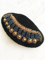 Add some vintage charm to your hair with this hand-crafted seed bead barrette. Made in France, it's a unique and stylish accessory that will elevate any hairstyle. Perfect for adding a touch of playfulness to your look!  Made by hand in France  113mm x 58mm