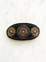 Add some vintage charm to your hair with this hand-crafted seed bead barrette. Made in France, it's a unique and stylish accessory that will elevate any hairstyle. Perfect for adding a touch of playfulness to your look!  Made by hand in France  113mm x 58mm