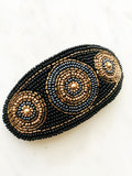 Add some vintage charm to your hair with this hand-crafted seed bead barrette. Made in France, it's a unique and stylish accessory that will elevate any hairstyle. Perfect for adding a touch of playfulness to your look!  Made by hand in France  113mm x 58mm