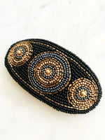 Add some vintage charm to your hair with this hand-crafted seed bead barrette. Made in France, it's a unique and stylish accessory that will elevate any hairstyle. Perfect for adding a touch of playfulness to your look!  Made by hand in France  113mm x 58mm