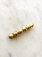 Upgrade your hair game with this stylish Vintage Gold Barrette. This barrette adds a touch of vintage charm to any hairstyle. Elevate your look effortlessly with this unique accessory!  58mm x 10mm