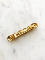 Upgrade your hair game with this stylish Vintage Gold Barrette. This barrette adds a touch of vintage charm to any hairstyle. Elevate your look effortlessly with this unique accessory!  58mm x 10mm