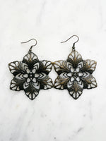 Large Antique Bronze Vintage Filigree Earrings
Add a touch of whimsy with our Vintage Filigree Earrings. These lightweight beauties feature intricate filigree designs for a boho vibe. Perfect for a playful and carefree look.
Lightweight brass metal stampings with an antique bronze patina.
70mm from the top of the ear hook x 57mm