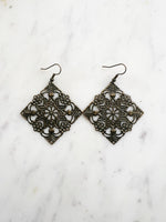 Large Antique Bronze Vintage Filigree Square Earrings
Add a touch of whimsy with these Vintage Filigree Earrings. These lightweight beauties feature intricate filigree designs for a boho vibe. Perfect for a playful and carefree look.
Lightweight brass metal stampings with an antique bronze patina.
65mm from the top of the ear hook x 49mm