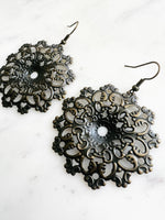 Large Antique Bronze Vintage Filigree Mystical Mandala Earrings
Add a touch of whimsy with our Vintage Filigree Earrings. These lightweight beauties feature intricate filigree designs for a boho vibe. Perfect for a playful and carefree look.
Lightweight brass metal stampings with an antique bronze patina.
60mm from the top of the ear hook x 48mm