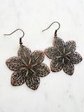 Antique Bronze Vintage Filigree Flower Earrings
Add a touch of whimsy with our Vintage Filigree Earrings. These lightweight beauties feature intricate filigree designs for a boho vibe. Perfect for a playful and carefree look.
Lightweight brass metal stampings with an antique rose gold patina.
60mm from the top of the ear hook x 43mm