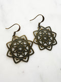 Antique Bronze Vintage Filigree Star Mandala Earrings
Add a touch of whimsy with our Vintage Filigree Earrings. These lightweight beauties feature intricate filigree designs for a boho vibe. Perfect for a playful and carefree look.
Lightweight brass metal stampings with an antique bronze patina.
43mm from the top of the ear hook x 30mm