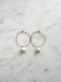 Elevate your style with these elegant Natural White Freshwater Rice Pearl Hoops. Featuring 8-9mm luminous natural white freshwater pearls delicately paired with 30mm hoops crafted from high-grade 304 Surgical Stainless Steel. Vacuum plated in Rhodium, these hoops offer a bright, durable finish and are perfect for sensitive skin. Timeless sophistication meets everyday wearability!