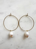 Elevate your style with these elegant Natural White Freshwater Rice Pearl Hoops. Featuring 8-9mm luminous natural white freshwater pearls delicately paired with 30mm hoops crafted from high-grade 304 Surgical Stainless Steel. Vacuum plated in Rhodium, these hoops offer a bright, durable finish and are perfect for sensitive skin. Timeless sophistication meets everyday wearability!