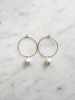 Elevate your style with these elegant Natural White Freshwater Rice Pearl Hoops. Featuring 8-9mm luminous natural white freshwater pearls delicately paired with 30mm hoops crafted from high-grade 304 Surgical Stainless Steel. Vacuum plated in Rhodium, these hoops offer a bright, durable finish and are perfect for sensitive skin. Timeless sophistication meets everyday wearability!