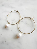 Elevate your style with these elegant Natural White Freshwater Rice Pearl Hoops. Featuring 8-9mm luminous natural white freshwater pearls delicately paired with 30mm hoops crafted from high-grade 304 Surgical Stainless Steel. Vacuum plated in Rhodium, these hoops offer a bright, durable finish and are perfect for sensitive skin. Timeless sophistication meets everyday wearability!