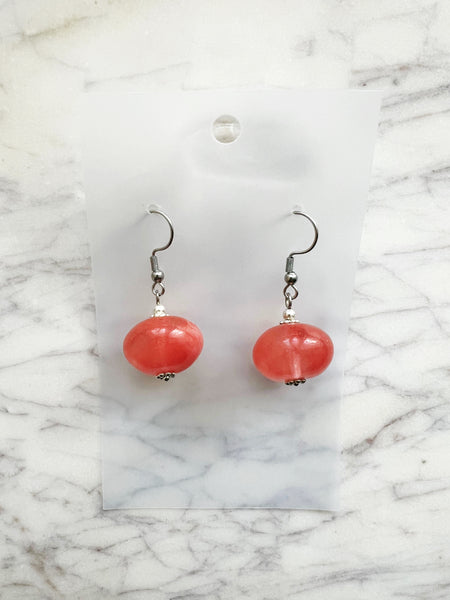 Peach Tourmalinated Quartz Rondelle Earrings on a marble surface