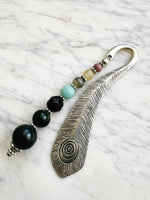 Silver feather bookmark with Indian Agate, Amazonite, Citrine and Rhodochrosite beads on a marble background