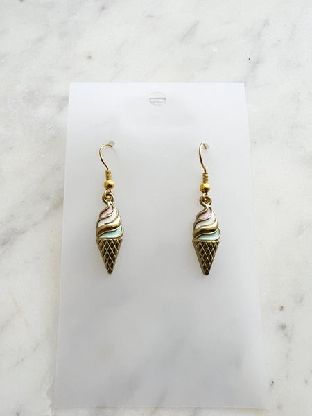 Kawaii Ice cream cone-shaped earrings on a marble background