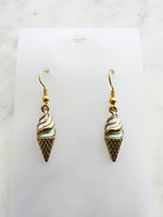 Kawaii Ice cream cone-shaped earrings on a marble background