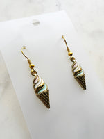 Kawaii Ice cream cone-shaped earrings on a marble background