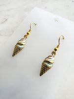 Kawaii Ice cream cone-shaped earrings on a marble background