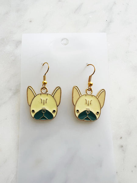 Kawaii Gold French bulldog earrings on a white card with a marble background