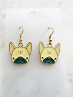 Kawaii Gold French bulldog earrings on a white card with a marble background