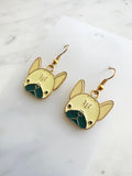 Kawaii Gold French bulldog earrings on a white card with a marble background