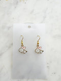 Pair of Kawaii bunny-shaped earrings on a white card with a marble background