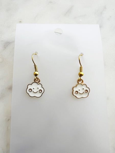 Pair of Kawaii cloud-shaped earrings with gold hooks on a white card.