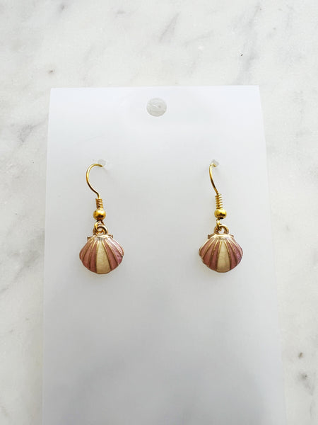 Kawai Shell-shaped earrings on a white card with a marble background