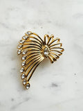 Vintage Gold-Plated Crystal Spray Brooch with  Marquis Center on a marble background