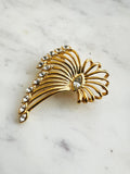 Vintage Gold-Plated Crystal Spray Brooch with  Marquis Center on a marble background