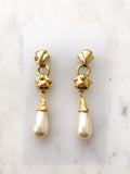 Look sharp with these sophisticated Vintage Gold Pearl Drop earrings! Crafted with an elegant gold finish, these earrings make a big impression. They'll give you that quintessential classic look, but with a unique twist. Go ahead, make a statement!  Gold Plated  60mm x 13mm