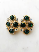 Introducing Harper, the perfect earrings to make your style stand out! These one-of-a-kind, emerald green clip-on earrings, with their glimmering crystals, will have you shining like a star (and feeling like one, too!) So, show a little sparkle, and strut your stuff!  Vintage Crystal  Gold Plated  Clip on Earrings  43mm x 26mm 