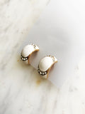 Glam-up your look with these sparkling Gold & White Enamel Half Huggie Clip On Earrings. Boasting an eye-catching design, these huggie earrings will take your outfit to the next level! Make the ordinary extraordinary and add a touch of glamour to your day. Woot woot!  Gold Plated  Clip On   21mm x 11mm