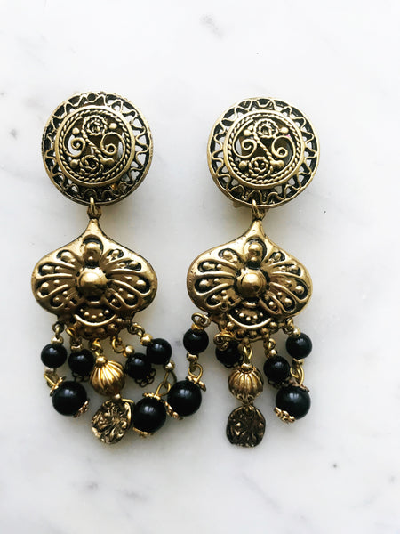 Add an antique touch to your wardrobe with these vintage bronze boho earrings! Featuring an intricate, eye-catching design, they'll add a bold and unique style to any outfit. Get ready to dazzle!  80mm x 26mm