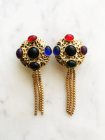 Wow your friends with these unique Vintage Retro Glass Bead Earrings! They'll be sure to provide an eye-catching sparkle to any look - no piercing required! Never boring and always sure to turn heads with these voguish, retro-chic earrings. Hop on the vintage bandwagon today!  Gold Plated   Clip On Earrings  70mm x 30mm 