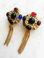 Wow your friends with these unique Vintage Retro Glass Bead Earrings! They'll be sure to provide an eye-catching sparkle to any look - no piercing required! Never boring and always sure to turn heads with these voguish, retro-chic earrings. Hop on the vintage bandwagon today!  Gold Plated   Clip On Earrings  70mm x 30mm 