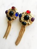 Wow your friends with these unique Vintage Retro Glass Bead Earrings! They'll be sure to provide an eye-catching sparkle to any look - no piercing required! Never boring and always sure to turn heads with these voguish, retro-chic earrings. Hop on the vintage bandwagon today!  Gold Plated   Clip On Earrings  70mm x 30mm 