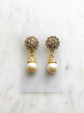 Turn heads with these vintage-inspired earrings! These dazzling beauties feature a crystal and pearl combo that's both classic and modern. Whether you're headed to a gala or a trip to the grocery store, these earrings will be sure to make a statement!  Gold Plated  55mm x 20mm