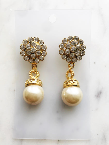 Turn heads with these vintage-inspired earrings! These dazzling beauties feature a crystal and pearl combo that's both classic and modern. Whether you're headed to a gala or a trip to the grocery store, these earrings will be sure to make a statement!  Gold Plated  55mm x 20mm