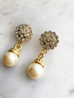 Turn heads with these vintage-inspired earrings! These dazzling beauties feature a crystal and pearl combo that's both classic and modern. Whether you're headed to a gala or a trip to the grocery store, these earrings will be sure to make a statement!  Gold Plated  55mm x 20mm