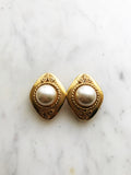 Add some vintage dazzle to your everyday look with these domed pearl clip-on earrings. Magnificently designed, they feature a sleek, classic finish that will make heads turn! These pearls have style that won't ever go out of fashion!  Gold Plated  Clip On   40mm x 30mm