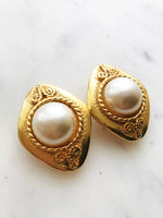 Add some vintage dazzle to your everyday look with these domed pearl clip-on earrings. Magnificently designed, they feature a sleek, classic finish that will make heads turn! These pearls have style that won't ever go out of fashion!  Gold Plated  Clip On   40mm x 30mm