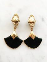 These vintage earrings are sure to put the 'cha' in 'chic'! For the fashion maven who's looking for old-school glamour, these Art Deco Enamel Earrings will add classic elegance to any look. With their timeless design and intricate details, they'll help you make a statement without ever having to say a word!  Clip On Earrings  Gold Plated  62mm x 35mm