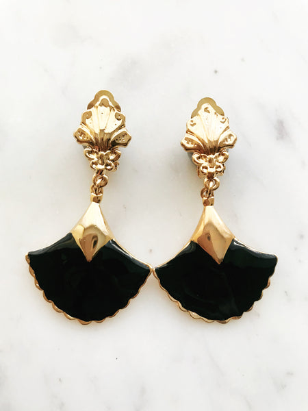 These vintage earrings are sure to put the 'cha' in 'chic'! For the fashion maven who's looking for old-school glamour, these Art Deco Enamel Earrings will add classic elegance to any look. With their timeless design and intricate details, they'll help you make a statement without ever having to say a word!  Clip On Earrings  Gold Plated  62mm x 35mm