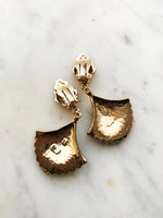 These vintage earrings are sure to put the 'cha' in 'chic'! For the fashion maven who's looking for old-school glamour, these Art Deco Enamel Earrings will add classic elegance to any look. With their timeless design and intricate details, they'll help you make a statement without ever having to say a word!  Clip On Earrings  Gold Plated  62mm x 35mm