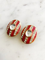 Ignite your style with these Red Enamel Crystal Clip-on Earrings, perfect for unleashing your inner rebel. Let your outfit roar with confidence and stand out from the crowd!  Gold Plated   Clip On Earrings  31mm x 25mm